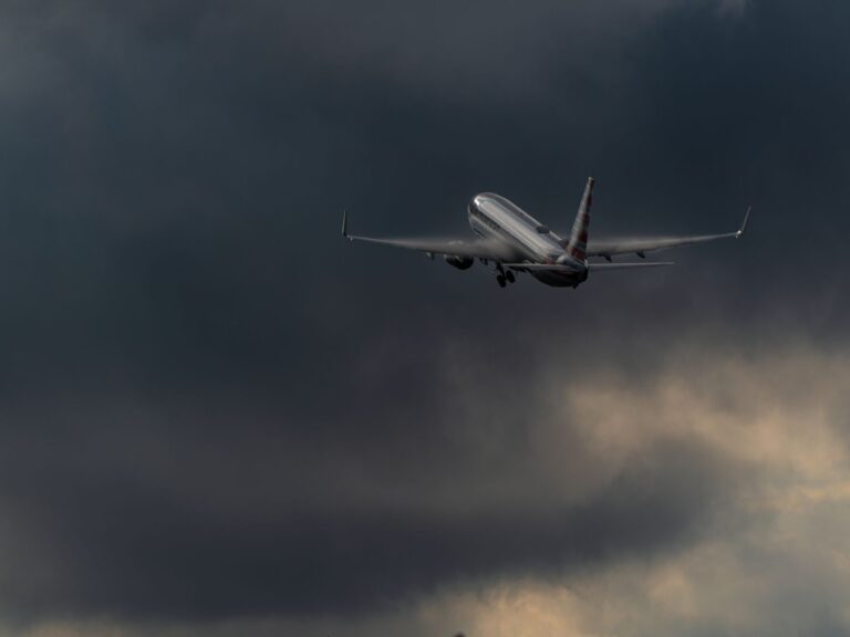 Commercial airplane ascending with stormy clouds in Río Segundo, Costa Rica.
