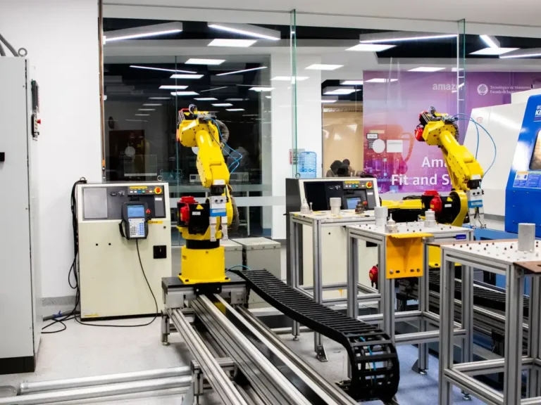 Robotic arms in action within a modern industrial control room setting, showcasing technology and production.